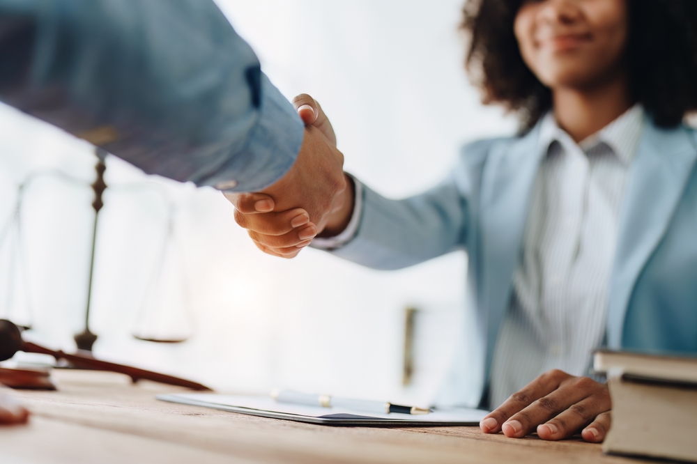 Photo of People Shaking Hands