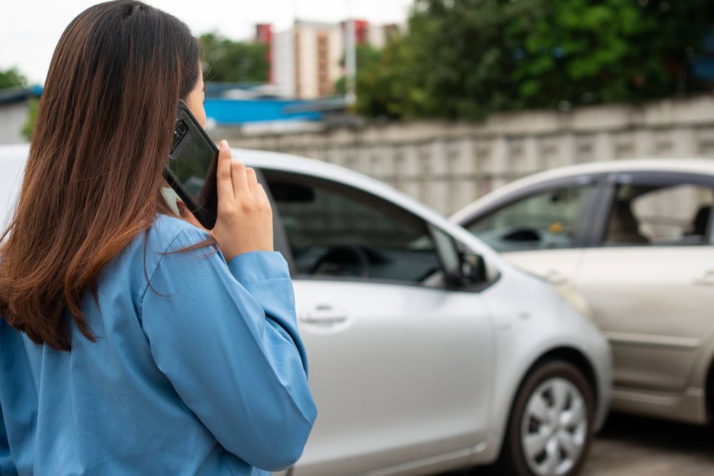 Woman Driver Woman next to car accident